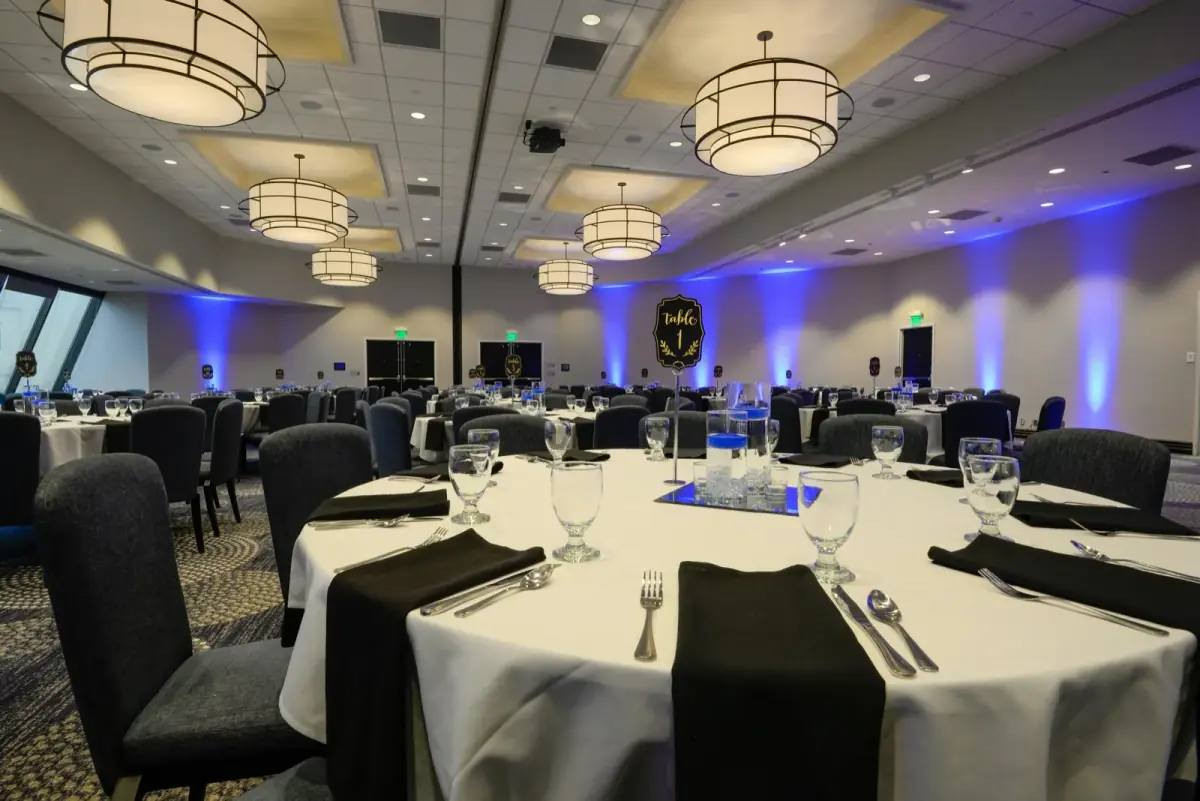 Banquet hall set under stage lighting